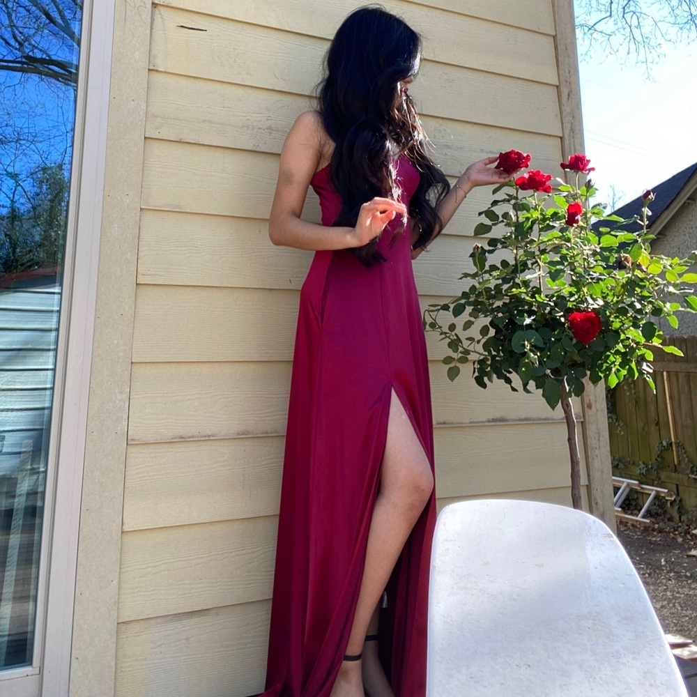 Simple burgundy dress with pockets.